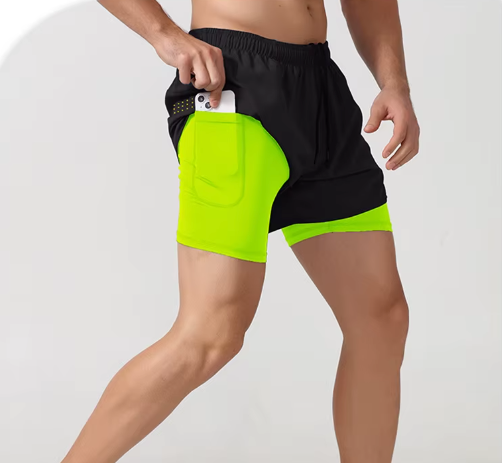 Neon green fitness shorts with a moisture-wicking, double-layered design for active sports
