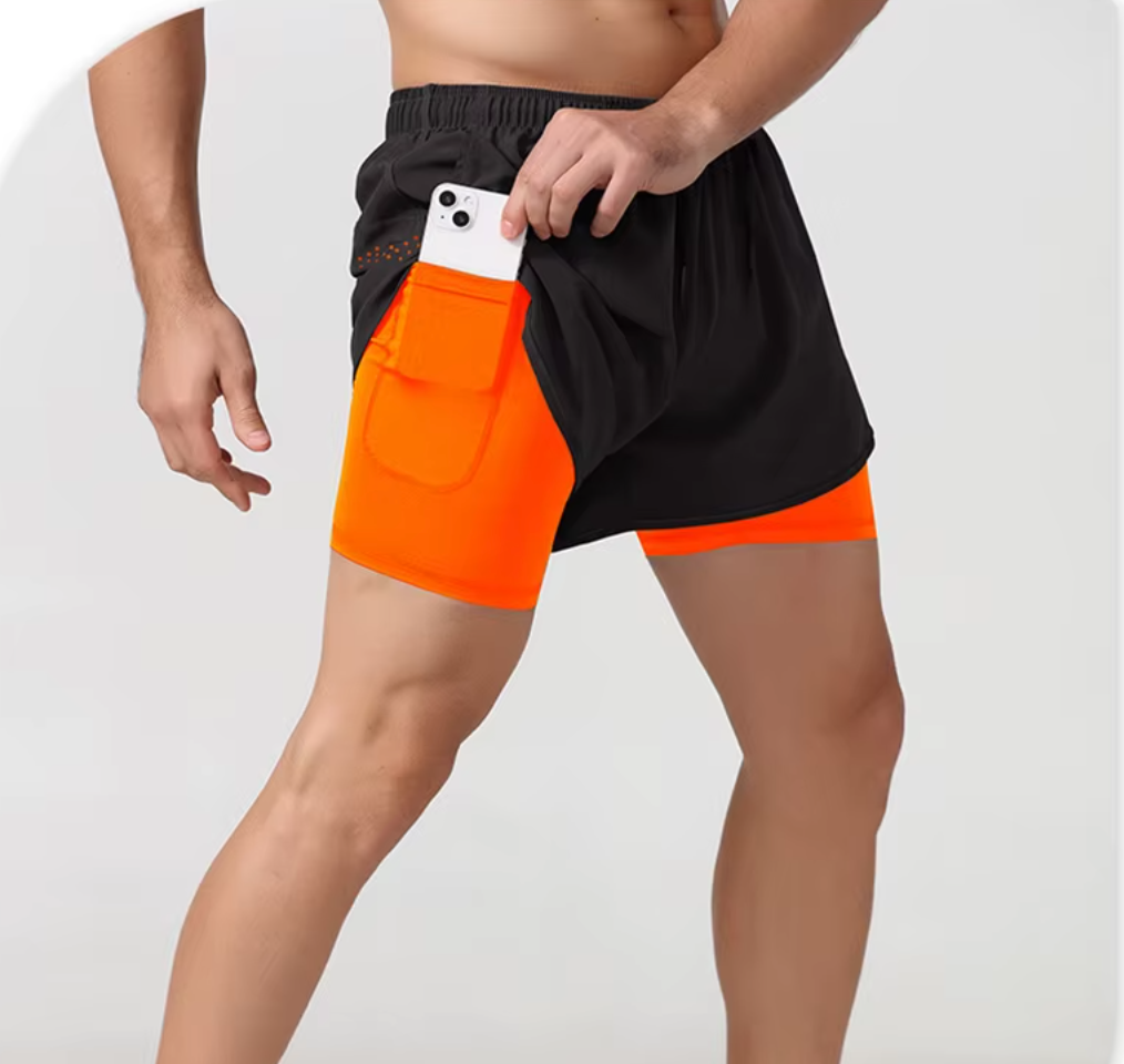 Neon orange quick-dry gym shorts with an inner compression layer for extra support